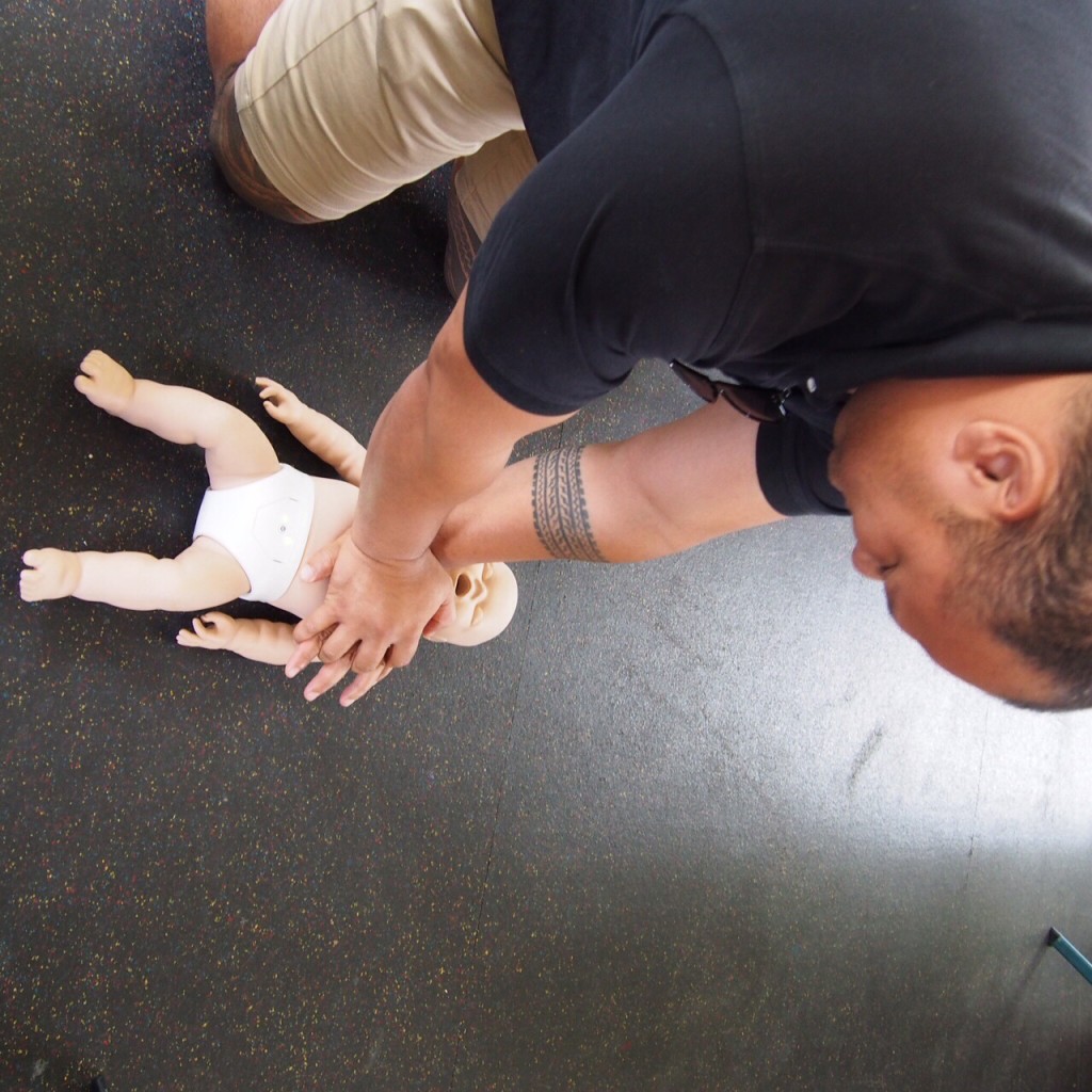 Herman testing out his CPR knowledge on the interactive dummy.