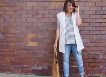 White vest outfit with ripped jeans and neutral accessories