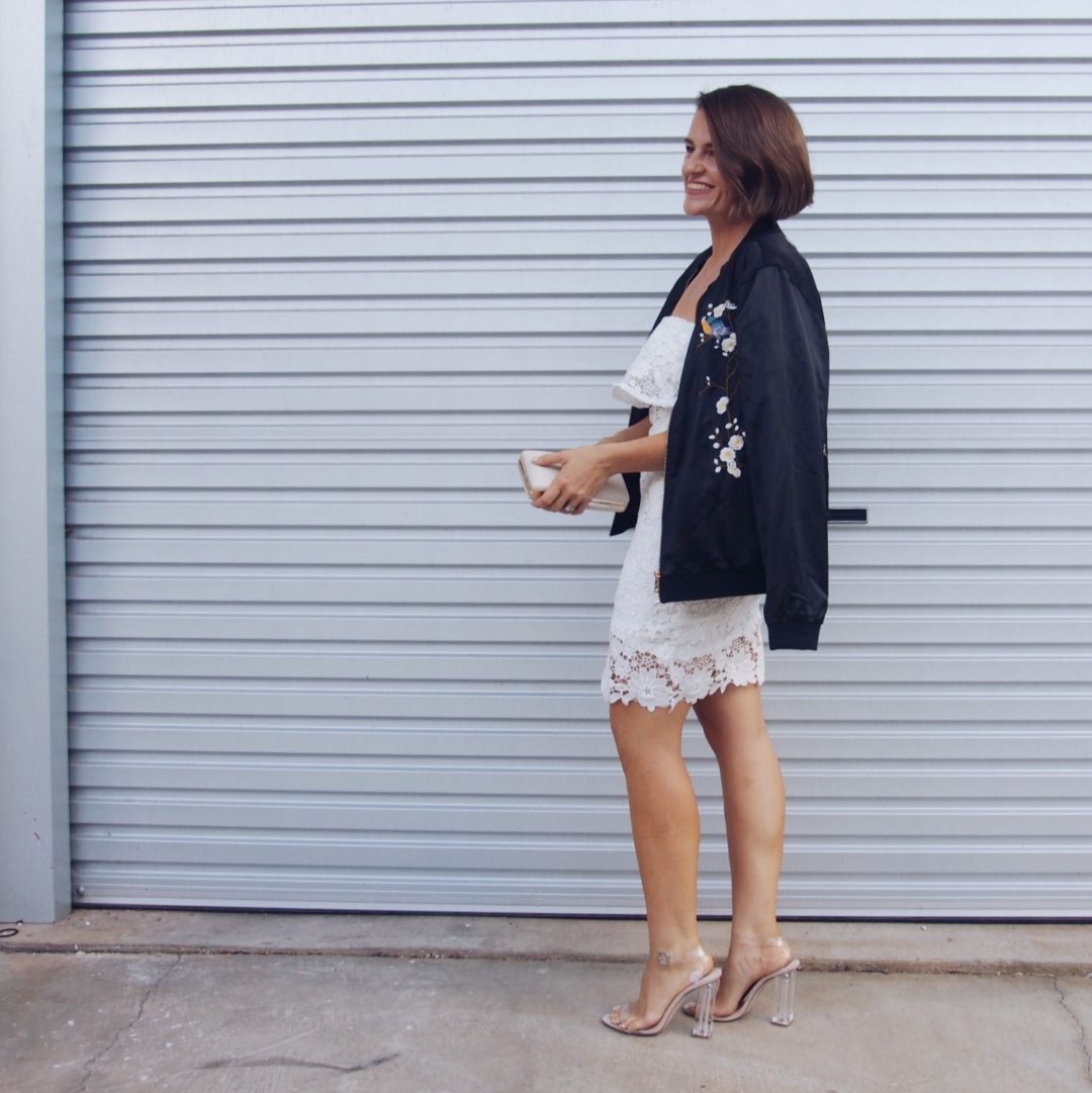 embroidered bomber jacket with white lace dress outfit