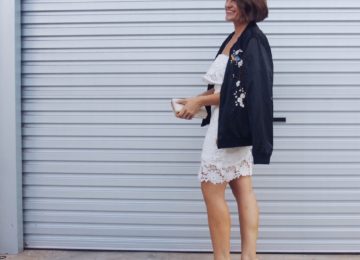 embroidered bomber jacket with white lace dress outfit